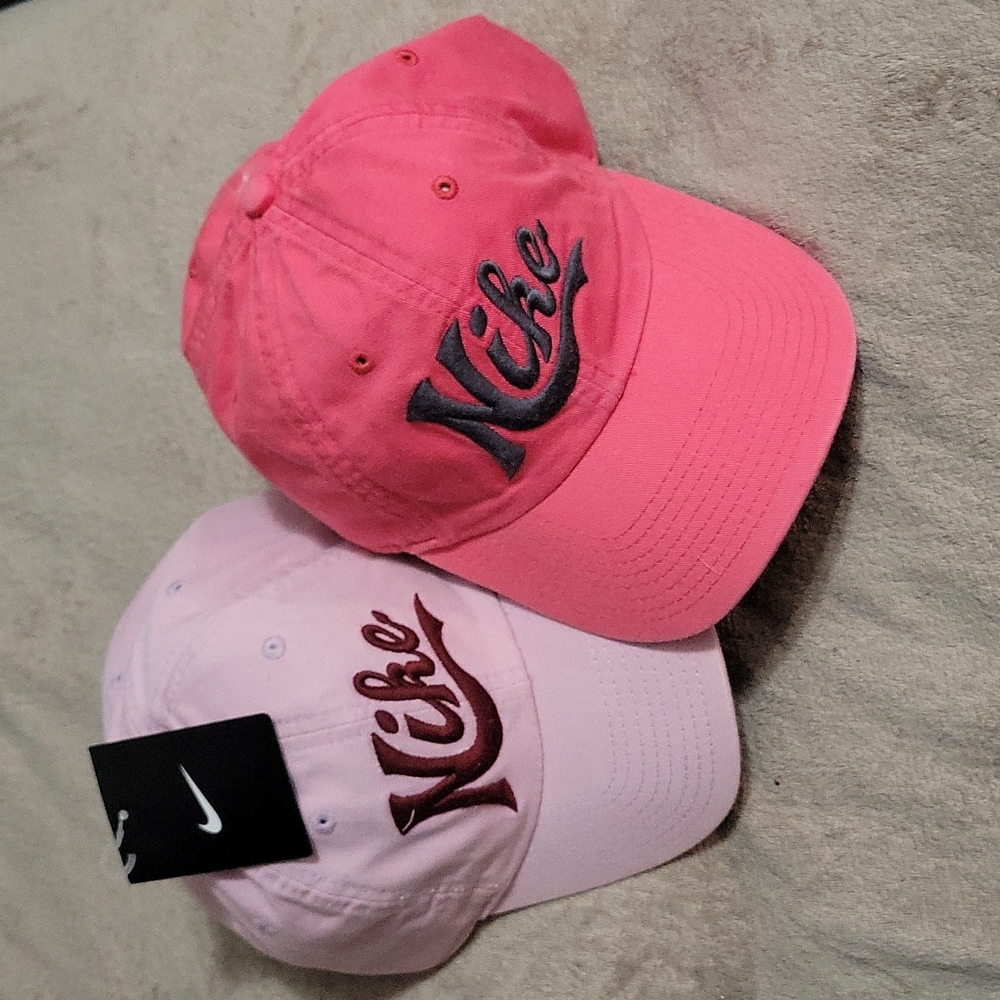 Lot of 2 NWT Pink Nike Hats. Cotton, adjustable strap. One size.